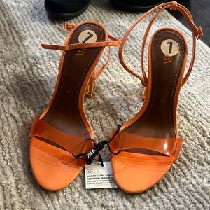 Orange transparent Zara heels.